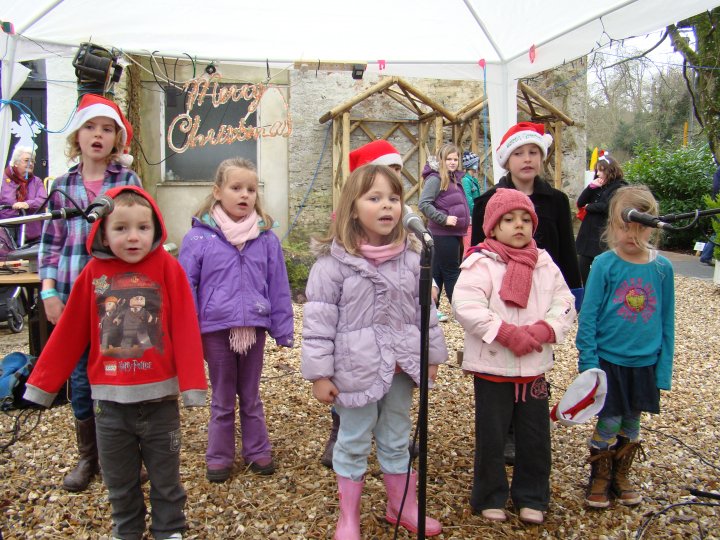 Project Performers singing at Lupton's Christmas event